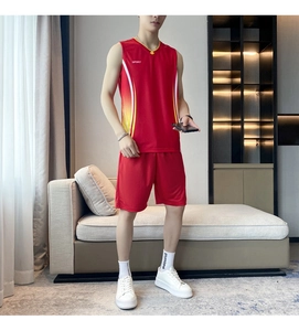 Detail of red men's sports set with V-neck vest and shorts featuring side stripes