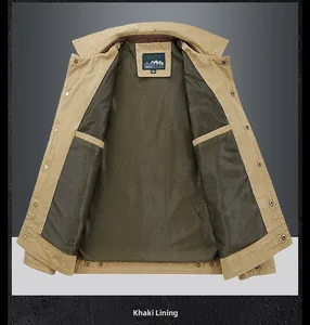 Detail view of khaki jacket's inner lining featuring dark mesh texture and snap buttons