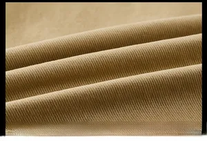 Macro shot of high-quality washed khaki twill cotton fabric with soft texture