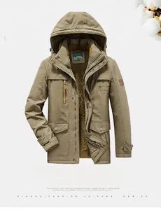Detail view of khaki winter parka showing thick brown fleece lining and zip pockets