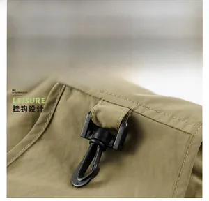 Detail of outdoor fishing vest with a swivel hook and durable fabric texture