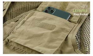 Detail of khaki outdoor vest showing large velcro flap pocket with mesh side paneling