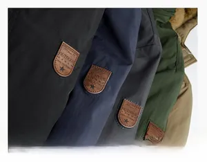 Detail of arm patch badge and texture of thermal fleece lining on various winter jackets