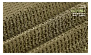 Detailed macro view of breathable mesh fabric on outdoor vest for enhanced ventilation
