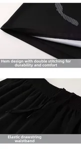 Detail view of black sports shorts featuring durable double stitching and elastic drawstring waist