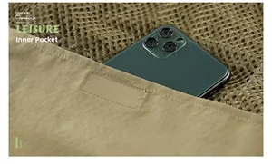 Detail of multi-pocket fishing vest showing spacious inner pocket with smartphone storage