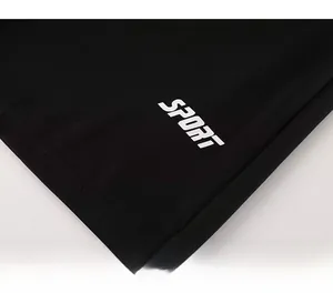 Detail of breathable mesh fabric and white SPORT lettering on black athletic wear