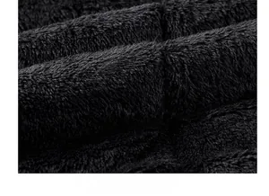 Close-up of thick black fleece lining fabric showing dense texture for winter warmth