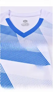 Detail of white soccer jersey featuring blue V-neck trim and breathable mesh fabric texture