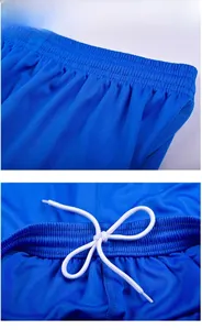 Detail of blue soccer shorts featuring breathable mesh fabric and elastic waist with drawstring