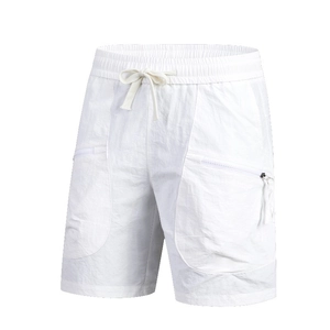 Detail view of men's white quick-dry shorts with elastic drawstring waist and zip pockets