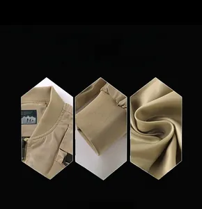Detail view of the ribbed stand collar and elastic cuffs on a khaki utility jacket