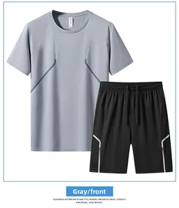 Détail du t-shirt de sport gris séchage rapide et du short noir aux lignes géométriques