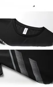 Gros plan du t-shirt de sport noir avec motif géométrique argenté et texture en mesh aéré