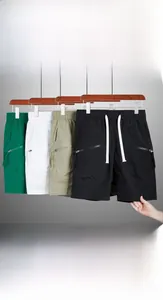 Close-up of quick-dry cargo shorts featuring elastic waistband and secure side zipper pockets
