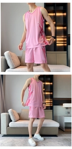 Detail of pink basketball jersey set featuring breathable mesh fabric and side stripe pattern