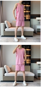 Detailed view of pink quick-dry basketball jersey set with athletic side paneling
