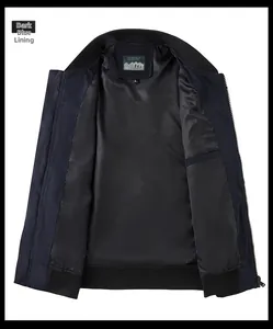 Detail view of navy bomber jacket featuring smooth polyester lining and interior pocket