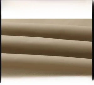 Detailed close-up of khaki twill fabric texture for pilot bomber jacket with 45-degree weave