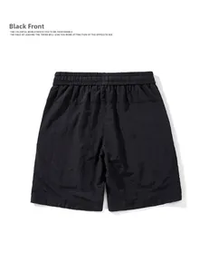 Macro detail of men's black quick-dry cargo shorts showing back elastic waistband texture