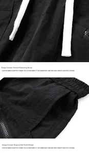 Detail of men's quick-dry shorts with drawstring waist and secure zipper pockets