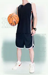 Detail of breathable black basketball jersey with orange and white side stripes