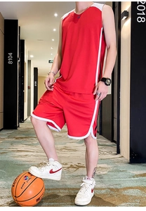 Detail view of red breathable basketball uniform set with side stripe design for sports