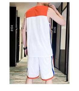 Rear view of breathable basketball kit with mesh texture and contrast orange stripes