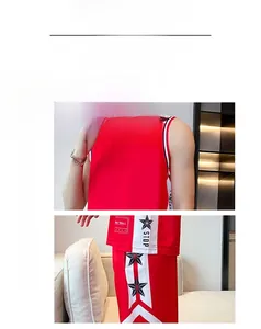 Detail of red quick-dry basketball jersey featuring side star prints and mesh fabric