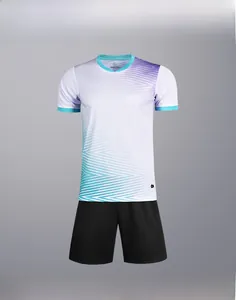 Detail view of white soccer jersey with blue gradients and black performance shorts