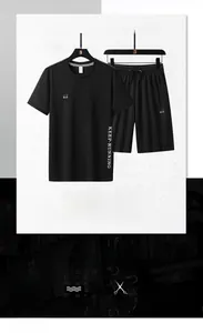 Detail view of black quick-dry men's sports set featuring KEEP-RUNNING print and soft fabric