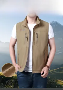 Detail showing breathable mesh fabric and zipper pockets on khaki outdoor fishing vest