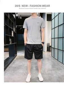 Ensemble de sport pour homme avec t-shirt gris et short noir, idéal pour le fitness