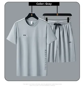 Detail view of grey quick-dry mesh fabric and KEEP-RUNNING print on men's sports set