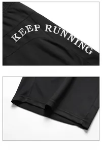 Detail of breathable honeycomb mesh fabric and Keep-Running print on black sportswear set