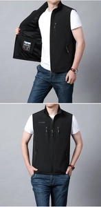 Detail showing the breathable mesh lining and brand label of a black outdoor fishing vest