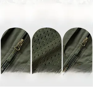Details der grünen Weste mit Metallreißverschluss, Netzfutter und Multi-Taschen