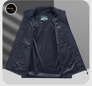 Detail view of breathable black mesh lining and inner pocket on a blue outdoor vest