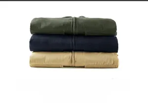 Pile of thickened winter work jackets in dark green, navy blue and khaki colors