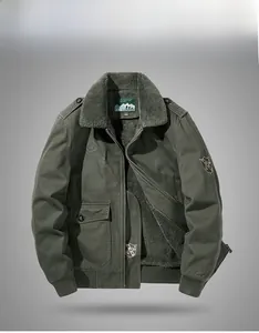 Detail of military green winter jacket featuring thick faux shearling lining and embroidery