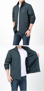 Détail de veste coupe-vent d'extérieur avec logo montagne, col montant et poche zippée