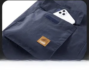 Detail of outdoor vest flap pocket with Velcro closure and leisure leather patch
