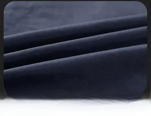 Detailed macro view of high-quality dark fabric texture with durable stitching for vests