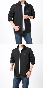 Détails d'une veste d'extérieur noire avec poignets élastiques et broderie de montagne