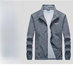 Detail of dark gray skin jacket with standing collar and outdoor professional logo