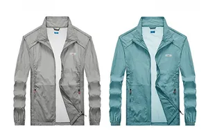 Detail of thin breathable outdoor jackets in gray and blue with zipper and stand collar