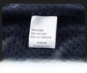 Macro detail of breathable mesh fabric and laundry care label on leisure vest