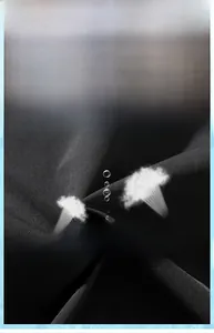 Macro shot of breathable black fabric showing moisture-wicking technology and texture