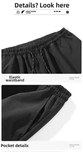 Detail view of elastic waistband with patterned drawstring and side pockets on sports pants