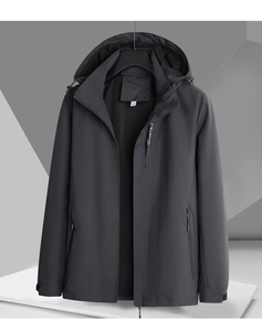 Détails de la veste coupe-vent gris foncé avec poignets réglables et poches zippées